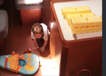 Carl exploring the floor while parents are storing food